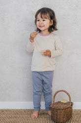Toddler girl in Avauma Peach Cloud ribbed pajama set – cozy cotton sleepwear for baby girls